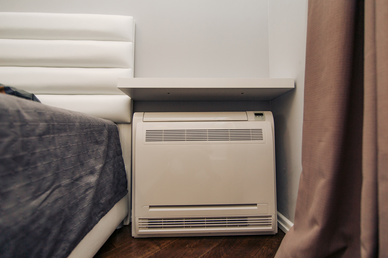 Square air conditioner in the apartment. On the floor, split system.